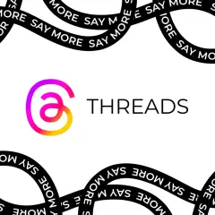 Logo Threads z hasłem "Say More". To platforma do dzielenia się myślami i rozmów.