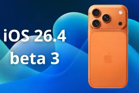 Pomarańczowy iPhone z potrójnym aparatem na tle niebieskich fal. Tekst: iOS 26.4 beta 3.